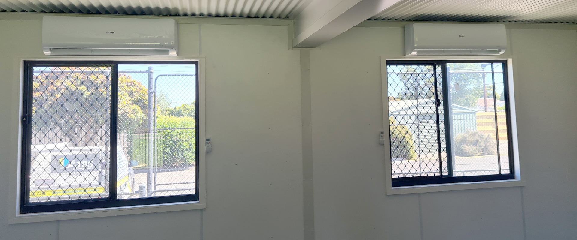 Two above Window Supply and install high wall split systems to 4 portable buildings classrooms