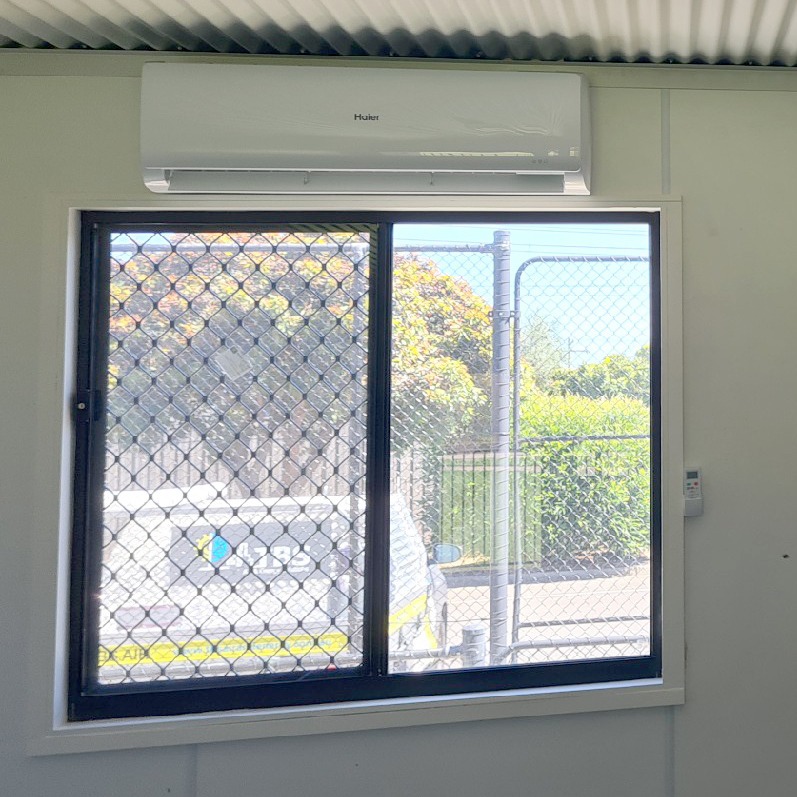 Above Window Supply and install high wall split systems to 4 portable buildings classrooms